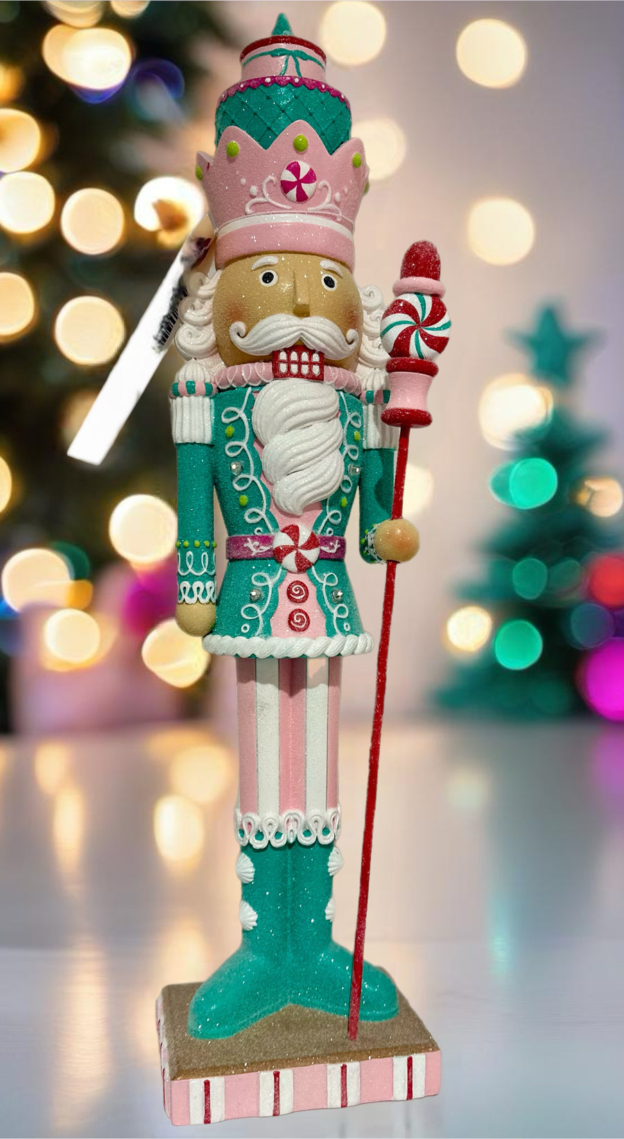 ILLUMINATED PASTEL NUTCRACKER WITH WHITE STRIPED PANTS